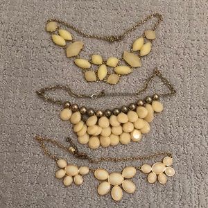 3 cream statement necklaces